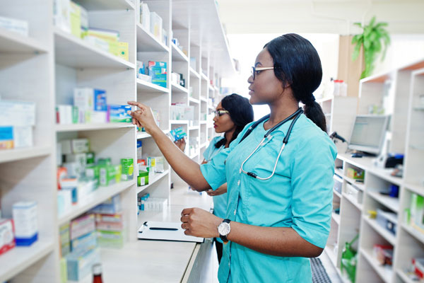 Pharmacy staff checking stock